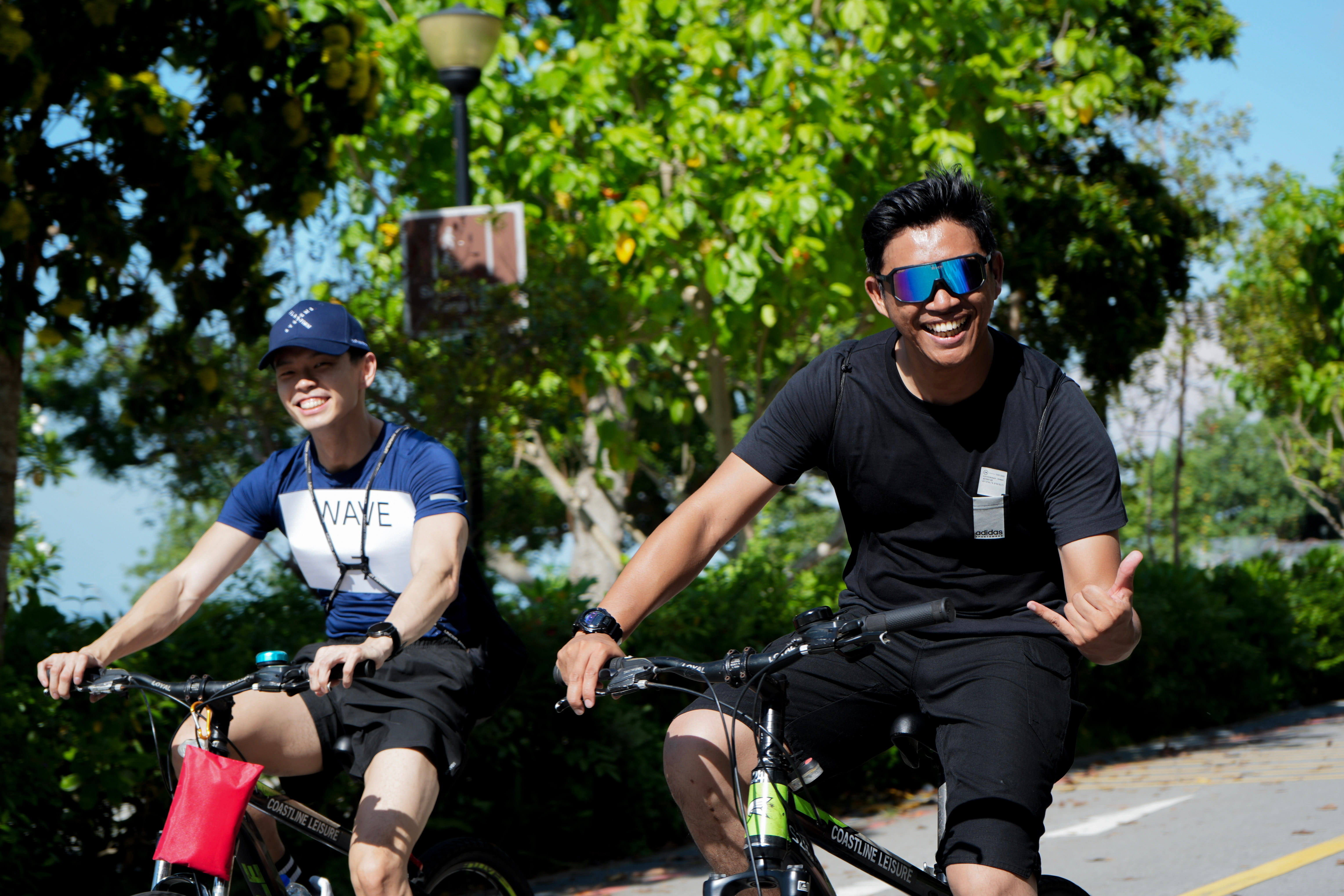 Two men on bikes.